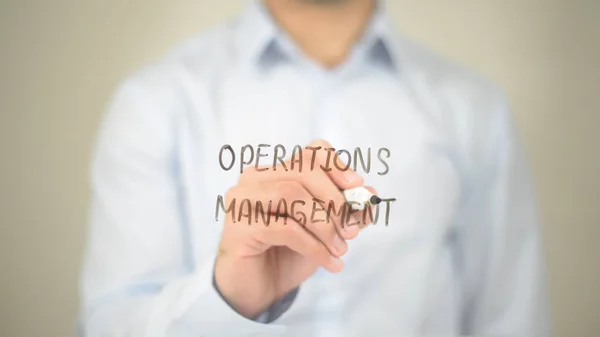 Operations Management , Man writing on transparent screen — Stock Photo, Image
