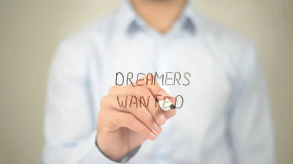 Sonhadores procurados, homem escrevendo na tela transparente — Fotografia de Stock