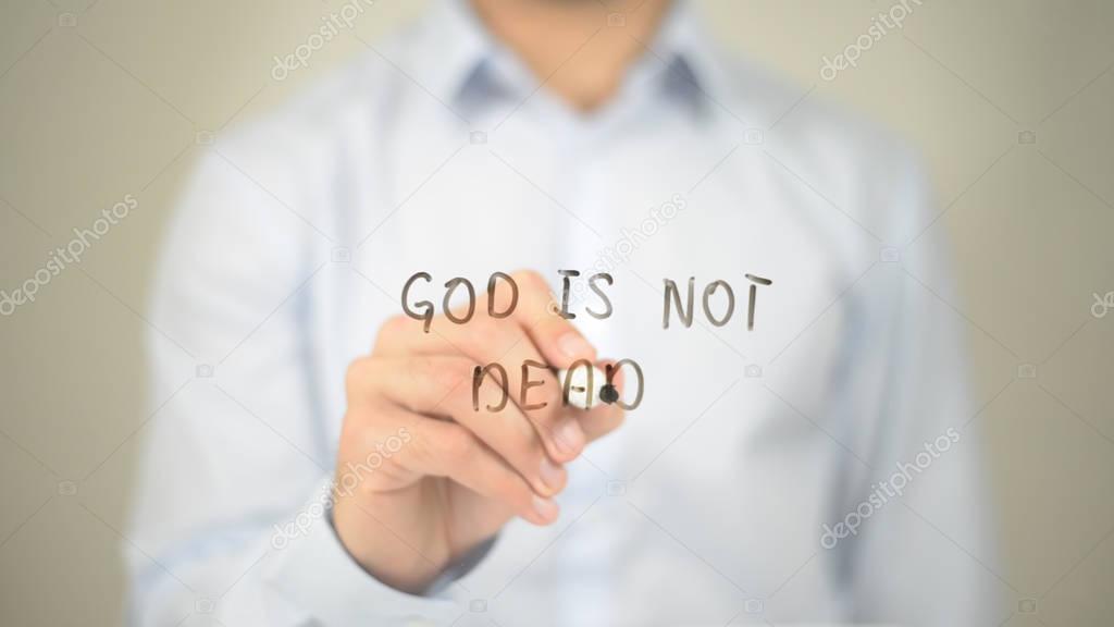 God is not Dead , Man writing on transparent screen