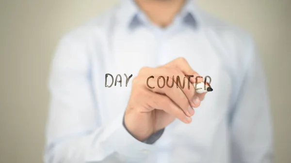 Day Counter, man writing on transparent screen — Stock Photo, Image