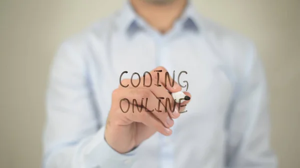 Coding Online, man writing on transparent screen — стоковое фото
