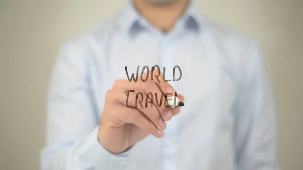 World Travel , людина пише на прозорому екрані — стокове фото