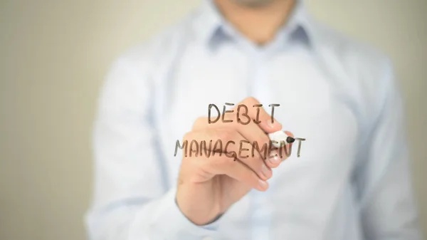 Schuldenverwaltung, Mann schreibt auf transparentem Bildschirm — Stockfoto