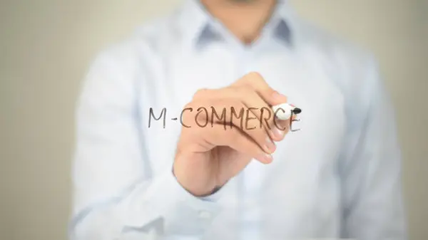 M-Commerce, man writing on transparent screen — Stock Photo, Image