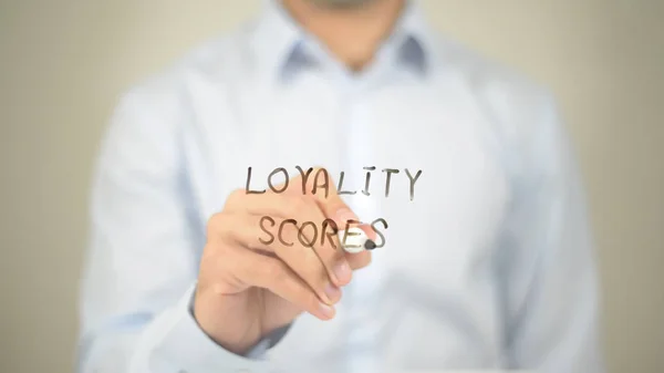 Loyality Scores, man writing on transparent screen