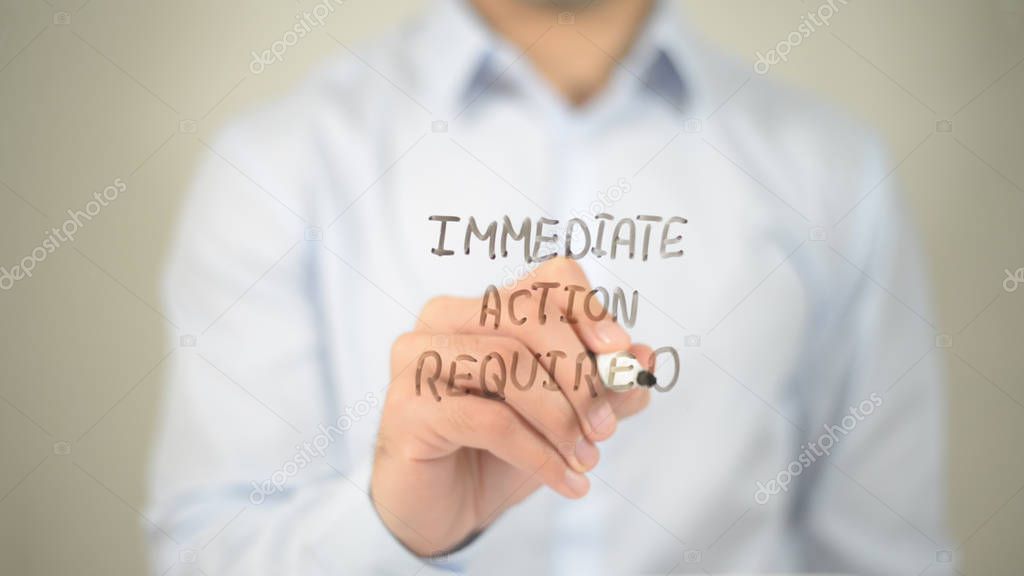 Immediate Action Required , man writing on transparent screen