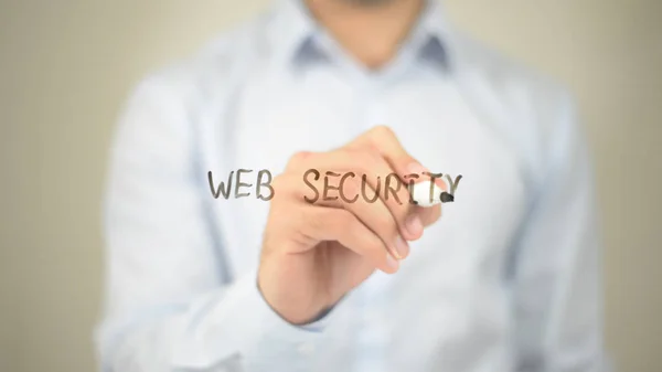 Web Security, Mand skriver på gennemsigtig skærm - Stock-foto
