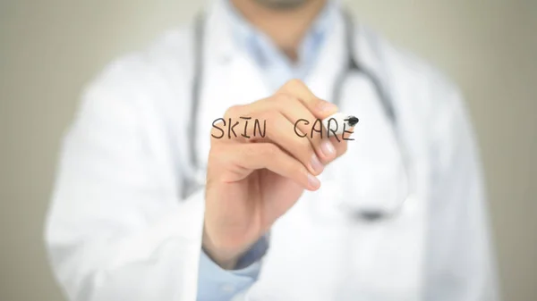 Skin Care, Doctor writing on transparent screen