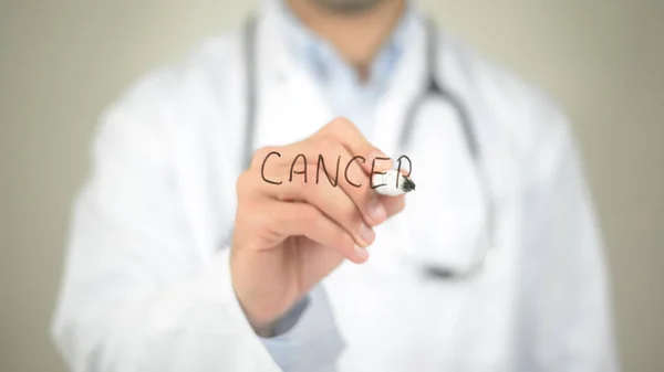 Cancer, Doctor writing on transparent screen — Stock Photo, Image