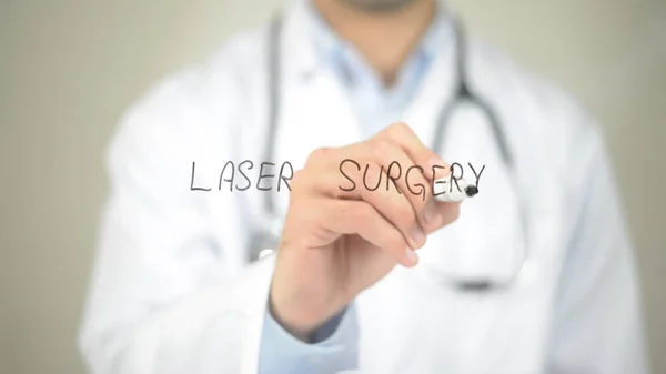 Laser Surgery  , Doctor writing on transparent screen — Stock Photo, Image