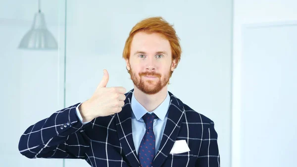 Thumbs Up by Redhead Businessman with Red Hairs
