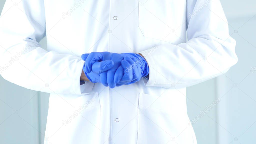 Research Scientist Hands in Gloves holding Eachother, Gesture