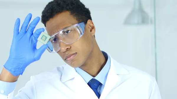 Astonished Scientist Holding and Examining, Looking on New Chip of Computer — Stock Photo, Image