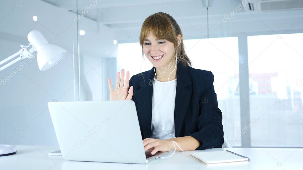 Busy Online Video Chat on Laptop at Work by Young Female