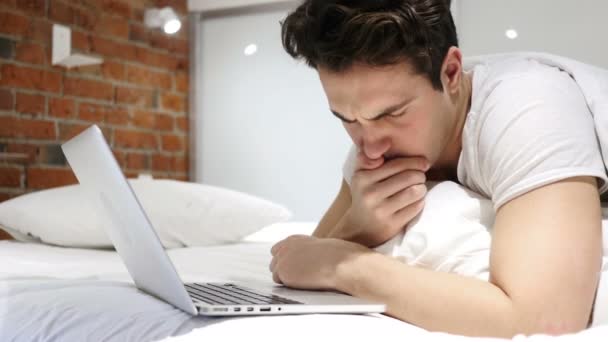 Portrait of Sick Man Coughing while Working on Laptop in Bed — Stock Video