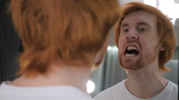 Redhead Beard Man Looking at His Face in Mirror — Stock Video