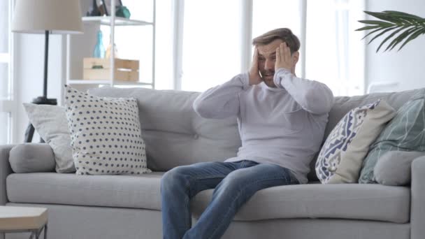 Adult Man Sitting on Couch in Anger, Feeling Frustrated — Stock Video