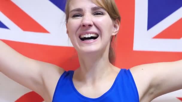 British Young Woman Celebrating while holding the British Flag in Slow Motion — Stock Video