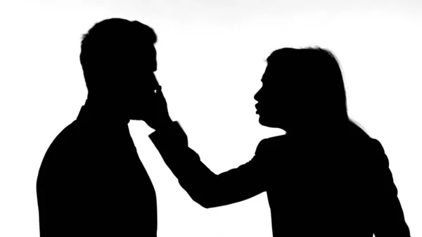 The Silhouette of Woman Slapping Partner while Fighting — стоковое фото