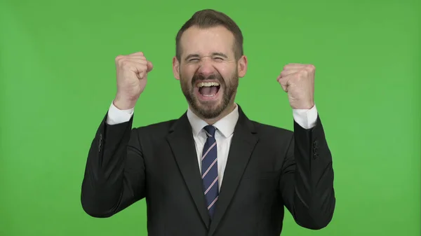 stock image The Happy Businessman getting Surprise and showing Fists against Chroma Key