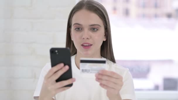 Portrait of Young Woman Celebrating Success on Smartphone — Stock Video