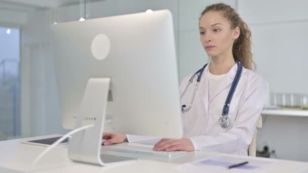 Portrait of Serious Young Female Doctor Working on Desk Top — Stock Video