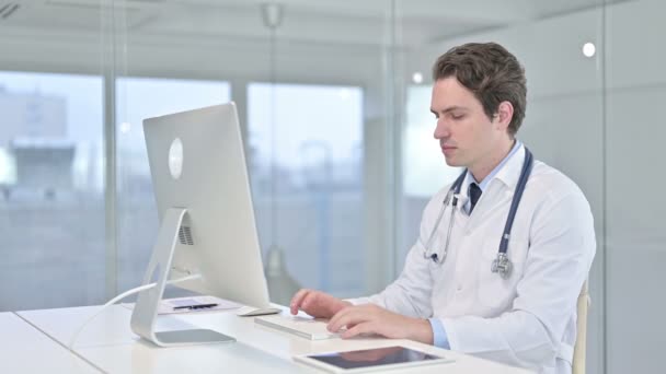 Young Doctor Smiling at the Camera in Modern Office — 图库视频影像