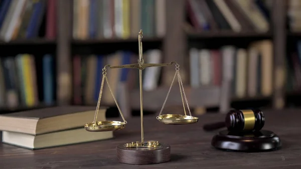 Gavel and Balance Scale on Judge Wooden Table