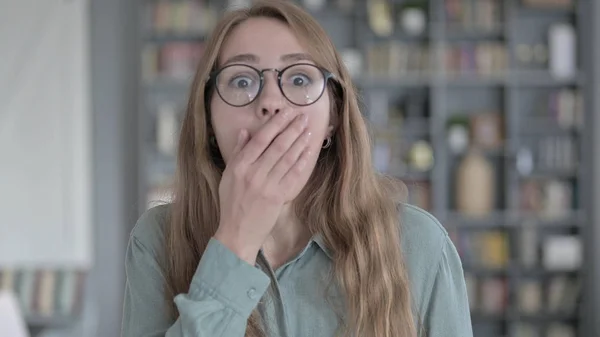 The Portrait of Shocked Woman getting Surprised in Office