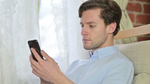 Portrait of Young Man doing Video Chat on Smartphone — 비디오