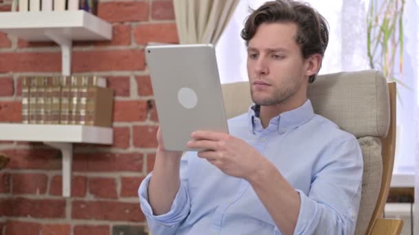 Ambitious Young Man get Surprise on Tablet — Stock Video