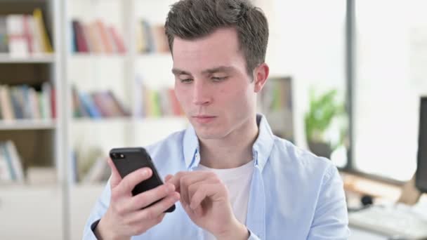 Cheerful Young Student using Smartphone — Stock Video