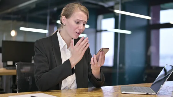 Young Businesswoman having Failure on Smartphone