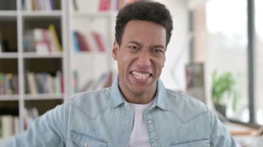 Excited Young African American Man Celebrating Success, Winning 