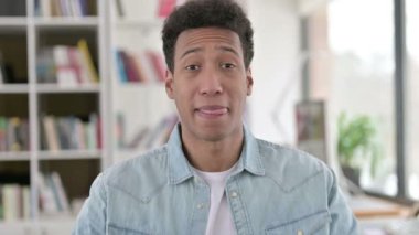 Welcoming Young African American Man Pointing at the Camera, Inviting 