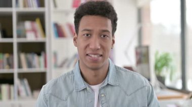 Victory Sign by Successful Young African American Man 