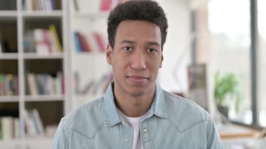 Smiling Young African American Man Looking at the Camera 
