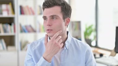 Thoughtful Young Man Thinking of New Idea
