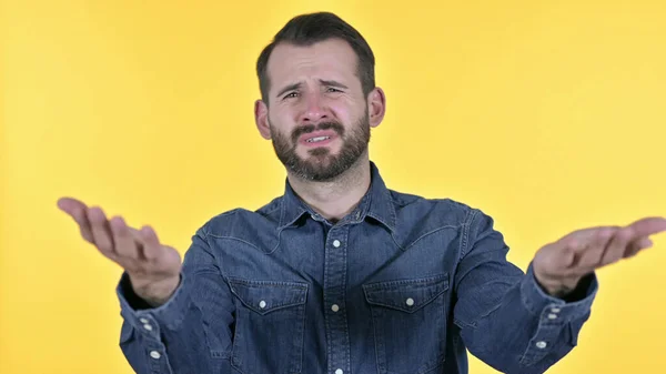 Portrait of Disappointed Young Man Reacting to Failure, Yellow Background — Stock Photo, Image