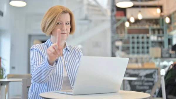 No, Finger Gesture by Creative Old Woman with Laptop in Cafe — ストック写真