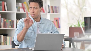 No, Young African American Man Rejecting by Finger Sign at Work