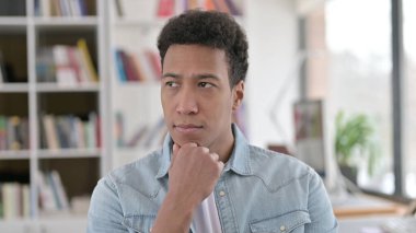 Pensive Young African American Man Thinking Idea, Brainstorming