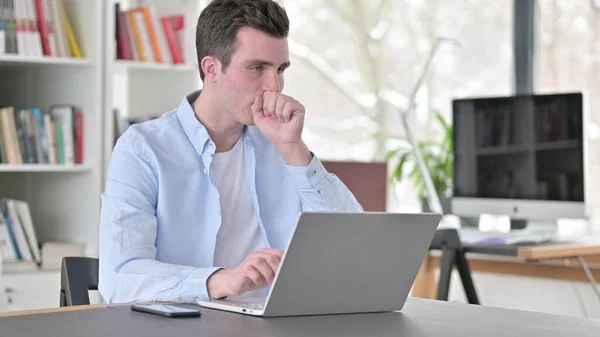Young Man having Coughing Working on Laptop — Stockfoto