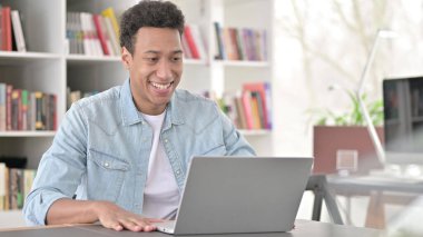 Online Video Chat on Laptop by Young African American Man