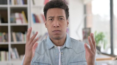 Saddened Young African American Man Reacting to Loss