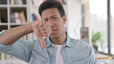 Thumbs Down by Disappointed Young African American Man