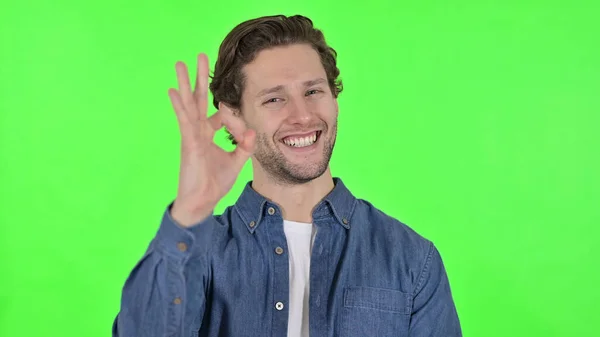 Ok Sign by Cheerful Young Man on Green Chroma Key — Φωτογραφία Αρχείου