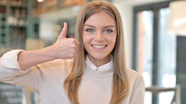Portrait of Thumbs up by Positive Young Woman — Stock fotografie