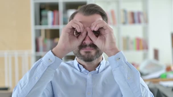 Portrait of Young Man with Binocular Sign with Hands — Stock Video