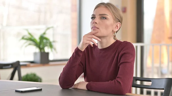 Pensive Young Woman Thinking in Office, Thoughts